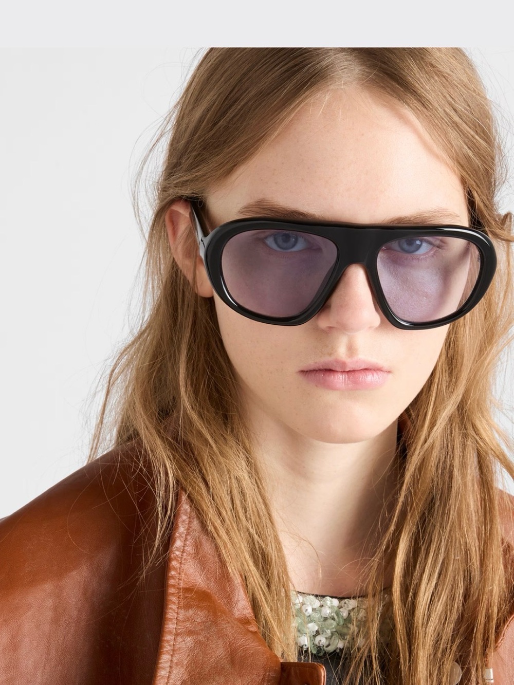 Prada Black Frame Sunglasses with Purple-Tinted Lenses